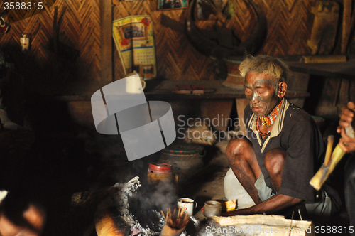 Image of Sitting around fire in Nagaland, India