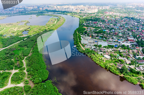 Image of Disrict of private houses on bank of river. Tyumen