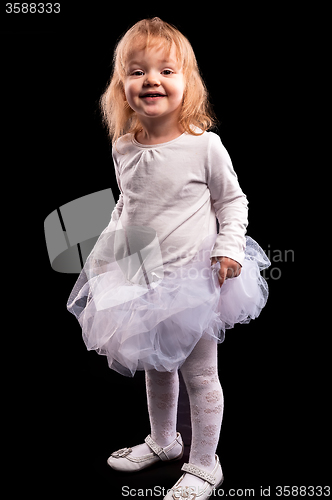 Image of Pretty little girl in white dress