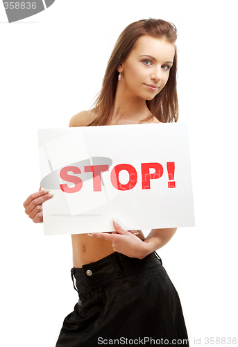 Image of lovely girl holding stop board