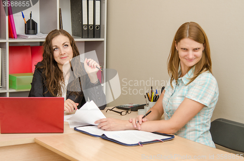 Image of The girl is angry from indifference to the problem at the office specialist