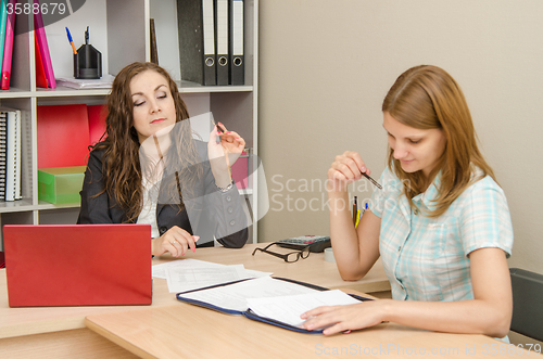 Image of Young beautiful girl on reception at office specialist