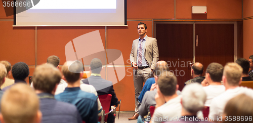 Image of Speaker Giving a Talk at Business Meeting.