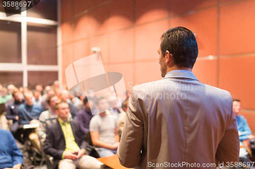 Image of Speaker at Business Conference and Presentation.