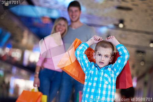 Image of young family with shopping bags