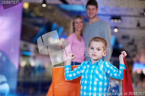 Image of young family with shopping bags