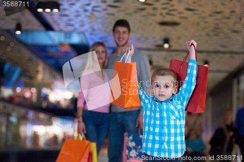 Image of young family with shopping bags