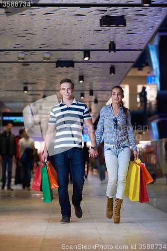 Image of young couple with shipping bags