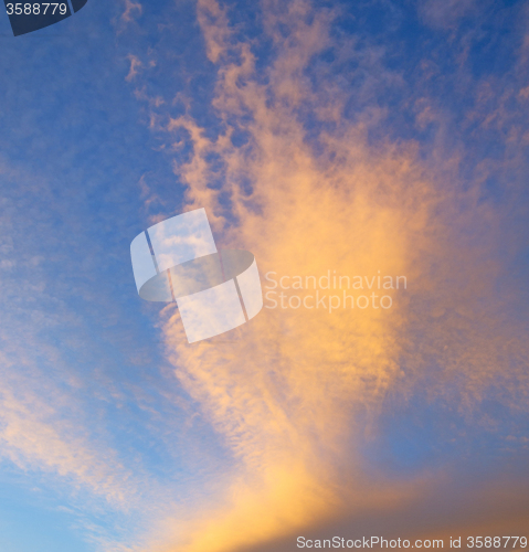 Image of sunrise in the colored sky white soft clouds and abstract backgr