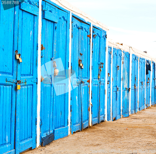 Image of in africa morocco  old harbor wood   door and the blue sky