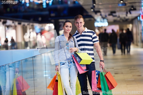 Image of young couple with shipping bags