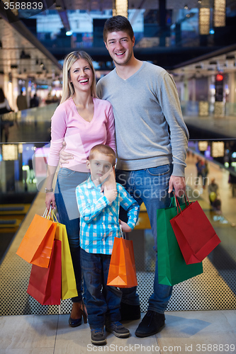 Image of young family with shopping bags