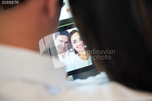 Image of couple at modern home using tablet computer