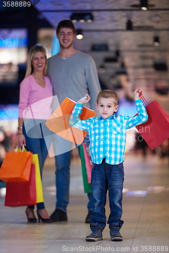 Image of young family with shopping bags