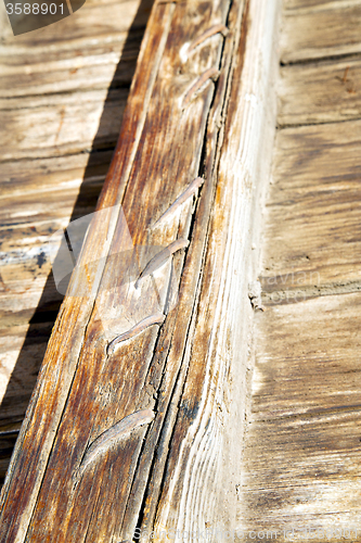 Image of metal nail dirty  paint in the    yellow  