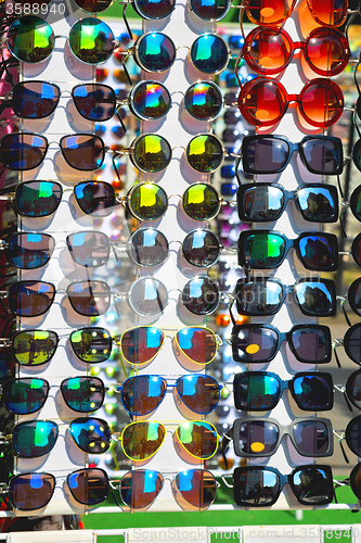 Image of in london glass and sunglasses in the light and reflex
