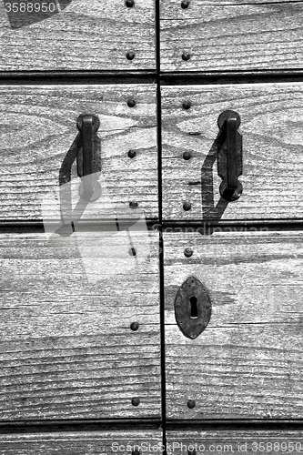 Image of door    in italy old ancian wood and traditional  texture nail