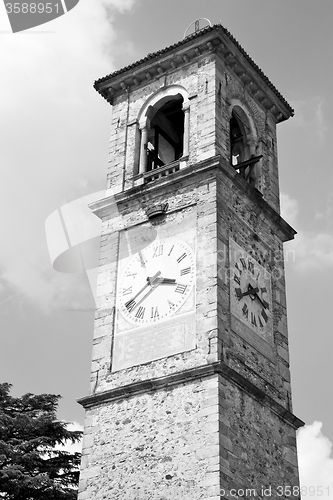 Image of ancien clock tower in italy europe old  stone and bell