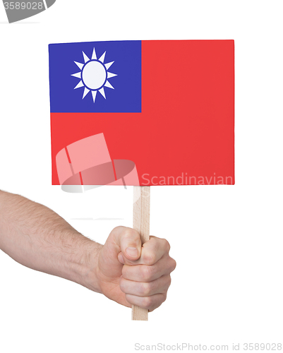 Image of Hand holding small card - Flag of Taiwan