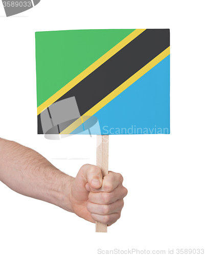 Image of Hand holding small card - Flag of Tanzania