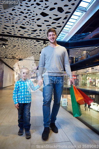 Image of young family with shopping bags