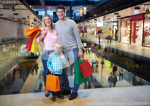 Image of young family with shopping bags