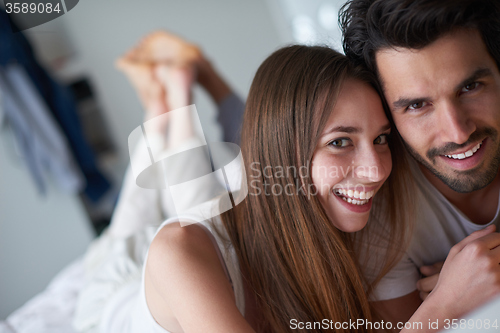 Image of couple relax and have fun in bed