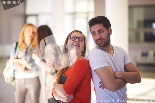 Image of students couple standing together