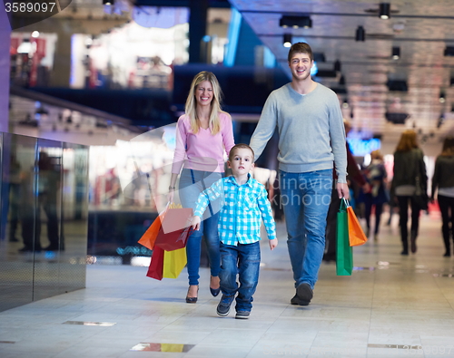 Image of young family with shopping bags