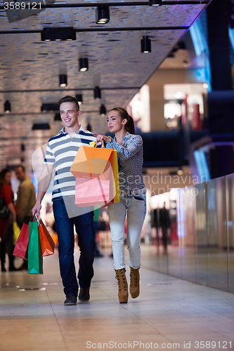 Image of young couple with shipping bags