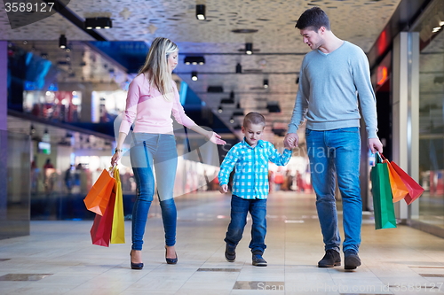 Image of young family with shopping bags