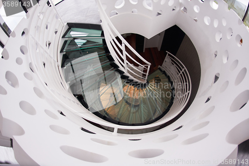 Image of modern glass spiral staircase