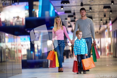 Image of young family with shopping bags