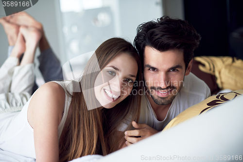 Image of couple relax and have fun in bed