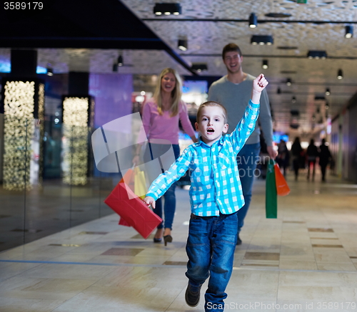 Image of young family with shopping bags
