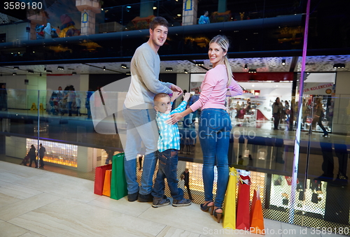 Image of young family with shopping bags