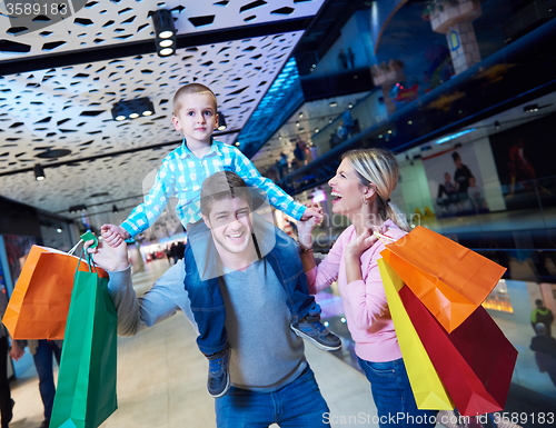 Image of young family with shopping bags