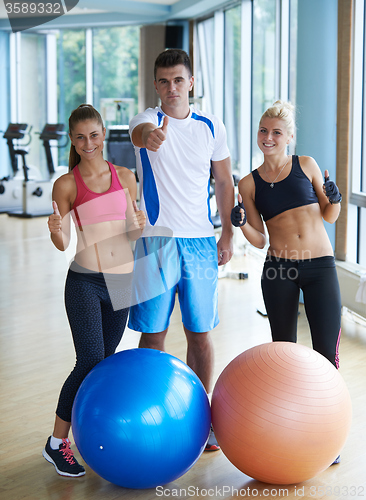 Image of people group in fitness gym