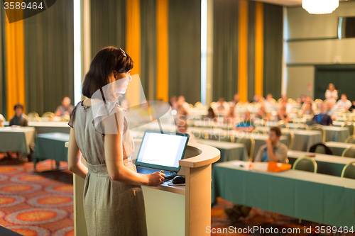 Image of Speaker at Business Conference and Presentation.