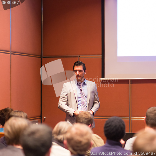 Image of Speaker Giving a Talk at Business Meeting.