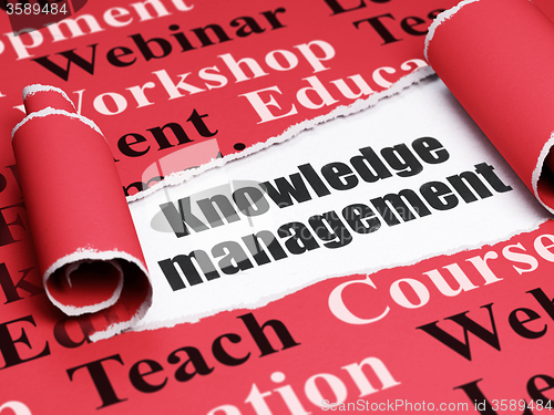 Image of Learning concept: black text Knowledge Management under the piece of  torn paper