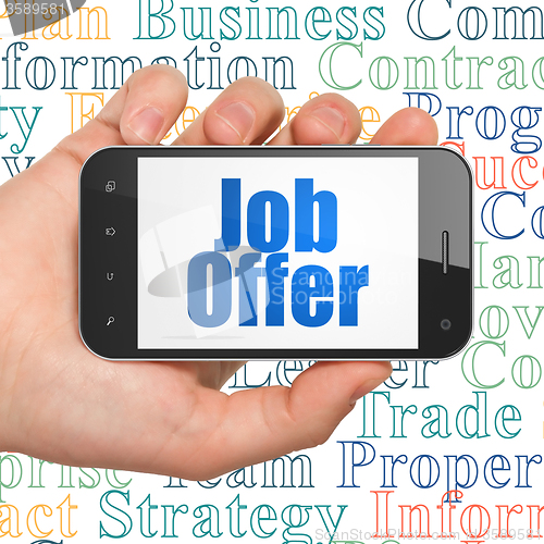 Image of Finance concept: Hand Holding Smartphone with Job Offer on display