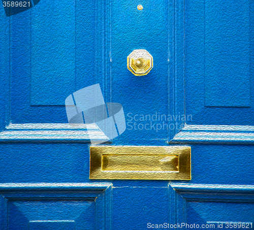 Image of  blue handle in london antique brown door  rusty  brass nail and