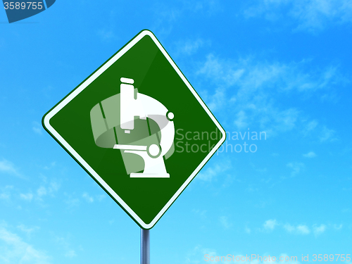 Image of Science concept: Microscope on road sign background
