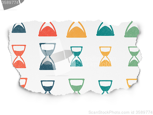 Image of Time concept: Hourglass icons on Torn Paper background