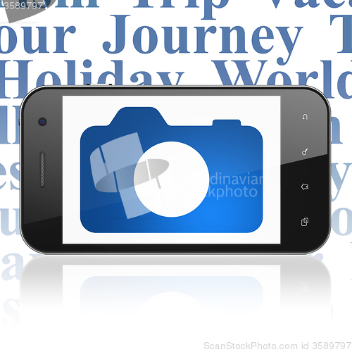 Image of Vacation concept: Smartphone with Photo Camera on display