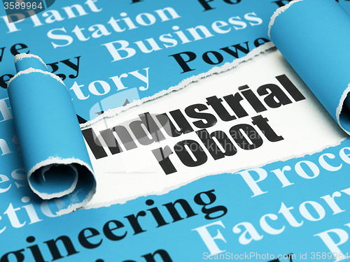 Image of Industry concept: black text Industrial Robot under the piece of  torn paper