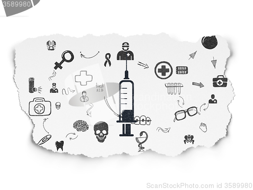 Image of Health concept: Syringe on Torn Paper background