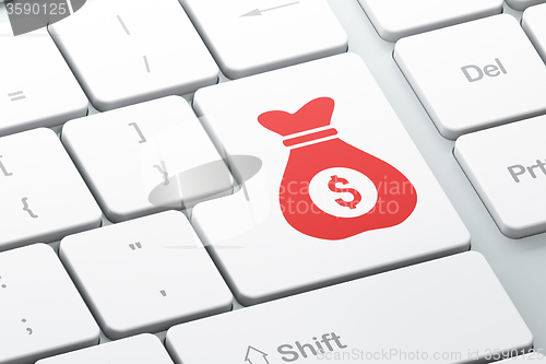 Image of Finance concept: Money Bag on computer keyboard background