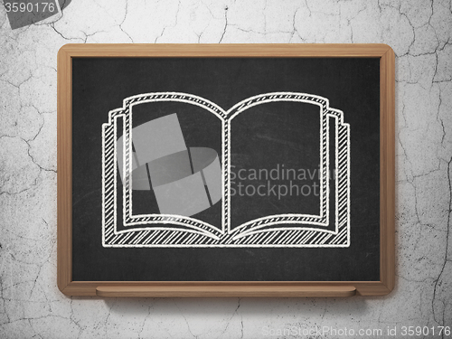 Image of Science concept: Book on chalkboard background